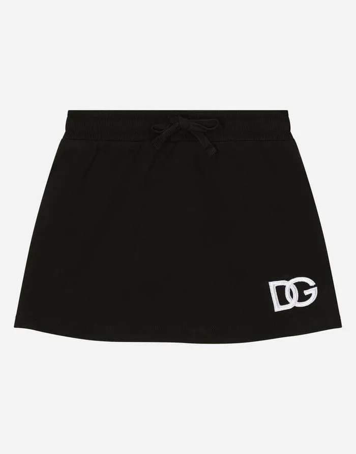 Dolce and Gabbana Trousers And Skirts Children Short Jersey Skirt With DG Logo Patch Black Dolce and Gabbana Trousers And Skirts Children Short Jersey Skirt With DG Logo Patch Black