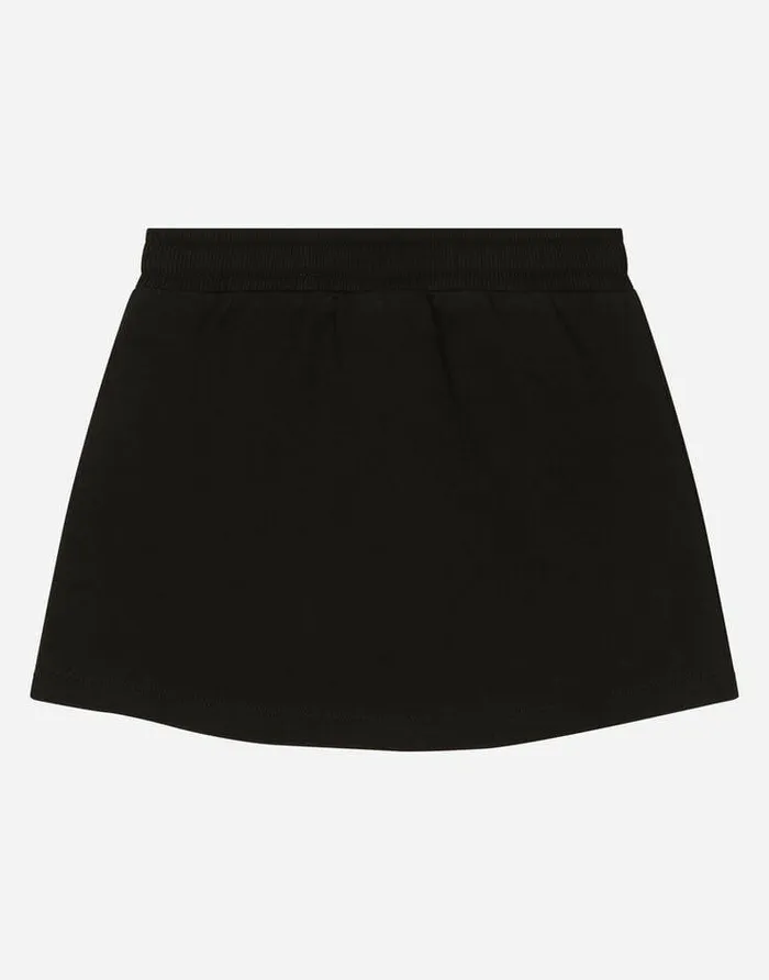 Dolce and Gabbana Trousers And Skirts Children Short Jersey Skirt With DG Logo Patch Black Dolce and Gabbana Trousers And Skirts Children Short Jersey Skirt With DG Logo Patch Black